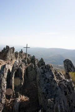 Cross in a summit mountain Foto stock