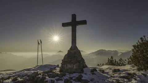 Cross of summit of a mountain Stock Photos