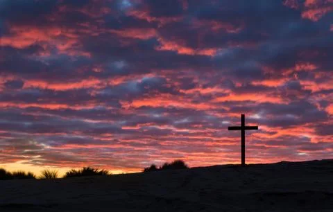 Cross sun setting Stock Photos