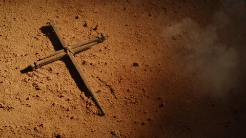 Cross symbol made of old nails on dusty surface.  Shot with RED 8K camera. Stock Footage 130357216