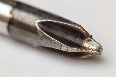 Cross tip of old screwdriver. Extremely closeup, super macro Stock Photos