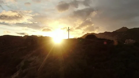 Cross on top of a hill on sunset Aerial view Stock Footage
