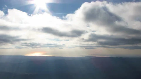 Cross on the top of a mountain - pan left Stock Footage 34534831