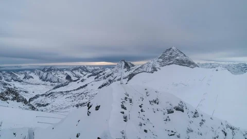 Cross on top of mountain panning shot looking over view of Alps Stock Footage 102444176