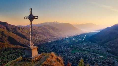 Cross on top of the mountain Stock Photos