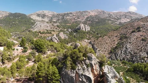 A cross on the top of a rock in Abdet village, in Alicante mountains, Spain Stock Footage