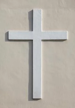 Cross on a wall Stock Photos