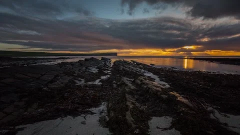 Cross wind Clouds and Sunset over Birsay Orkney HD Time Lapse Video stock 256084003
