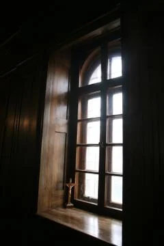 Cross at the window Stock Photos