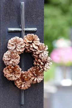 Cross with a wreath of cones Stock Photos