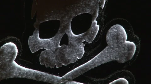 Crossbones on a dark background Stock Footage 67809680