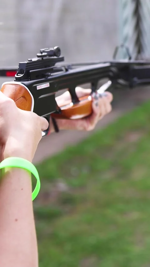 Crossbow shooting at shooting range, practicing compound bow and arbalest Stock Footage 320918431