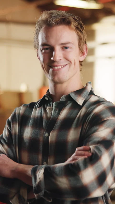 Crossed arms, man and face of carpenter in workshop with confidence for Stock Footage 343810139