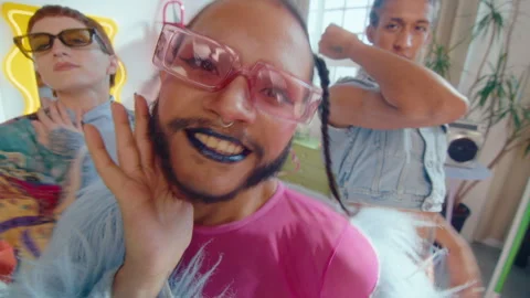 Crossed-Dressed Performer Posing on Camera with Queer Dance Crew Stock Footage 247554850