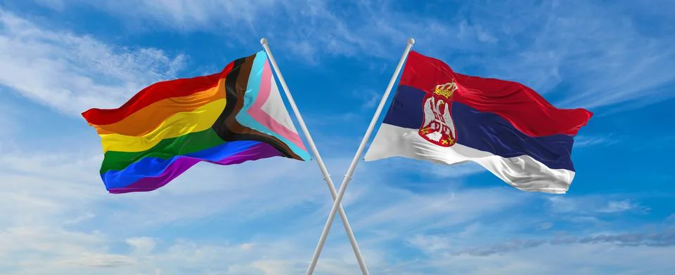 Crossed flags of progress lgbt pride and Serbia flag waving in the wind at cl Stock Illustration