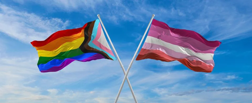 Crossed flags of progress lgbt pride and Lesbian Pride flag waving in the win Illustrazione stock