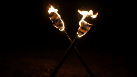 Crossed torches burn in the dark. Stock Footage 109382098