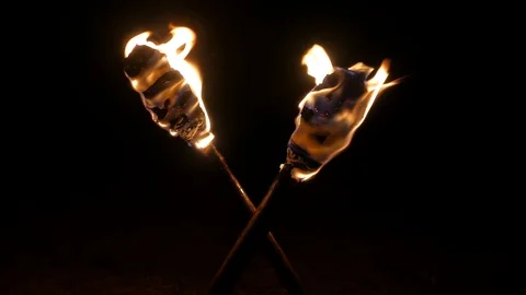 Crossed torches burn in the dark. Stock Footage 109382153