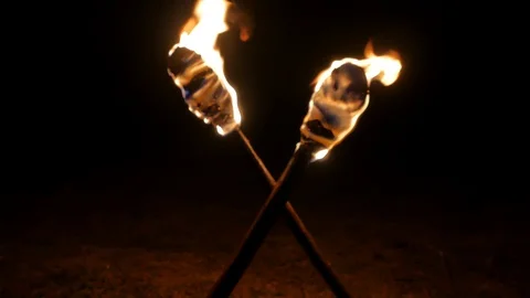 Crossed torches burn in the dark. Stock Footage 111177920