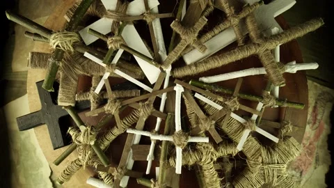 Crosses on wood table rotating in slow motion. Handmade Halloween props for v Stock Footage 141397786