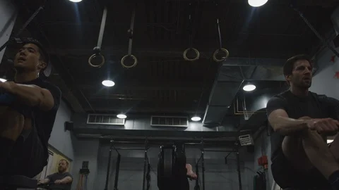 Crossfit Gym Members Using Exercise Machines Stock Footage 94970908