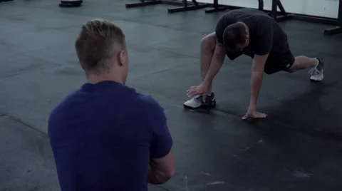 Crossfit instructor teaching students stretches Stock Footage 66856376