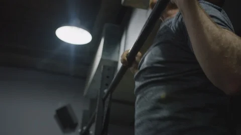 Crossfit Man in Gym Does Pull Ups Stock Footage 94969077