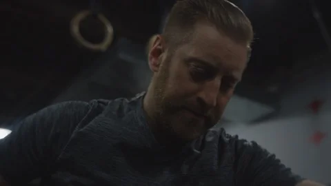 Crossfit Man in Gym Using Exercise Machine 2 Stock Footage 94968739