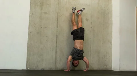 Crossfit Trainer Executing Strict Handstand Push Ups Body Weight Movement Stock-Footage 40035555