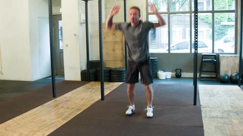 Crossfit Trainer performing Burpees in a certified box Stock-Footage 40034119