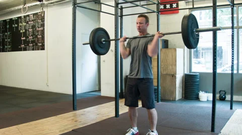 Crossfit Trainer Performing Heavy Cleans in a Certified Box Stock-Footage 40033765