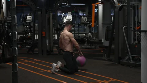 Crossfit workout of athletic man with ball in gym. athletic man has ball Stock Footage 222996473