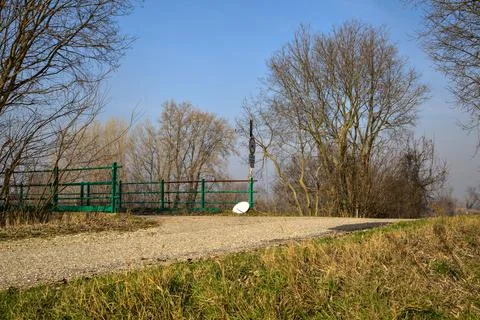 Crossing between a road and a bridge in the italian countryside in winter Stock Photos