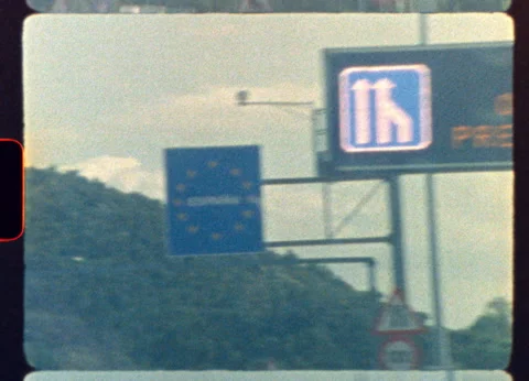 Crossing border into Spain on a retro highway with vintage road signs Video stock 319874993