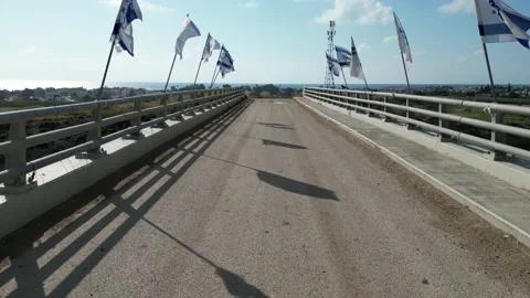 Crossing the bridge with flags Stockbeeldmateriaal 238823764