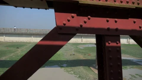 Crossing a bridge over a river by train in Bangladesh Stock Footage 153123656