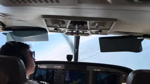 Crossing to a bush covered coast, cockpit view Stock Footage 346405865