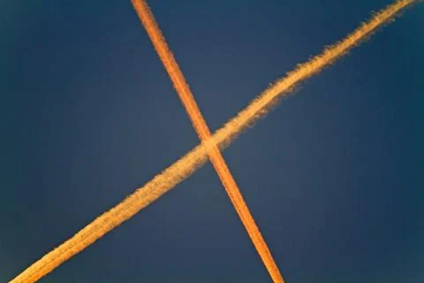 Crossing contrails Stock Photos