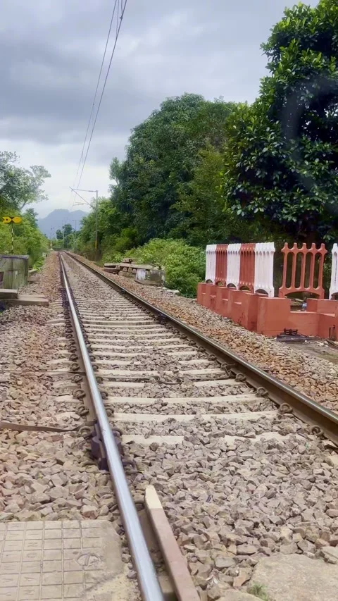 Crossing an Electrified Broad Gauge Railway Single Track in Rural Area, India 스톡 동영상 336310446