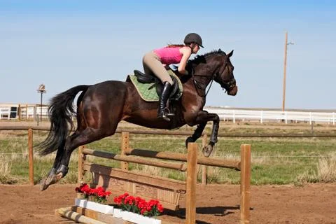Crossing a hurdle Stock Photos