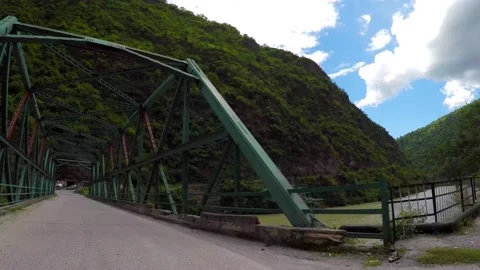 Crossing iron bridge in mountain Stock Footage 220407524