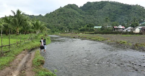 Crossing a Mountain Stream in the Philippines Stock Footage 279269731