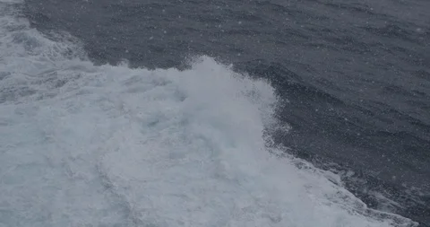 Crossing an ocean on the boat. Storm weather on the ocean with snow Stock Footage