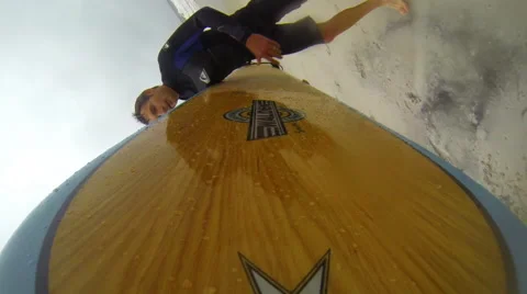 Crossing over rocks with longboard Stock Footage 42542836