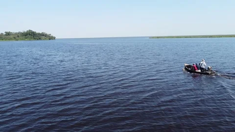 Crossing the Pristine Waters of Lago Ypoa in Paraguay Stock Footage 239920590