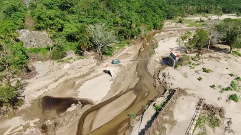 Crossing the river with a fallen bridge in Puebla Stock Footage 202090049