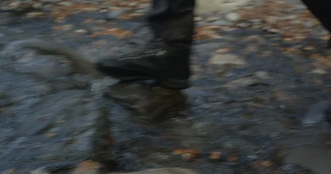 Crossing river in hiking boots Stock Footage 90079705