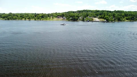 Crossing the river while a boat crosses our path 動画素材 158757156