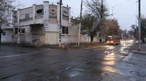 Crossing, running tram. Red tram passing street in Russia Stock Footage 19282034