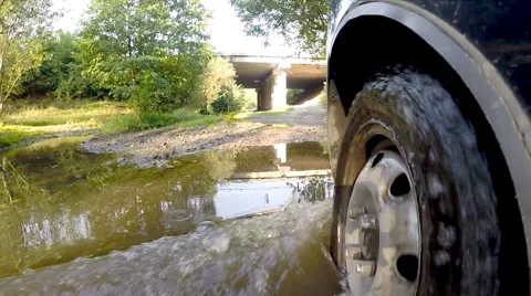 Crossing stream on a car. Stock Footage 42514070